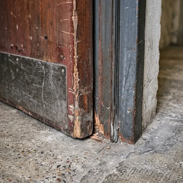Checking the gaps on a fire door
